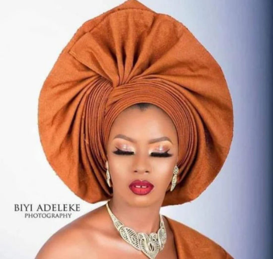 Queen Ayoka Aso-Oke Set in Burnt Orange.
